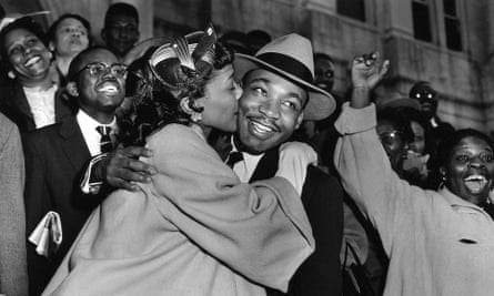 The Rev Martin Luther King Jr is welcomed with a kiss by his wife Coretta after leaving court in Montgomery, Alabama, in 1956.