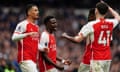 Arsenal's Bukayo Saka (centre) celebrates scoring their second goal.