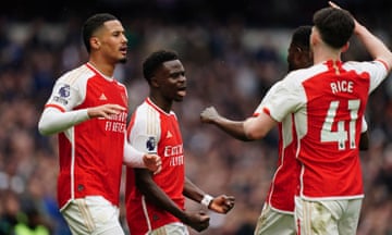 Arsenal's Bukayo Saka (centre) celebrates scoring their second goal.