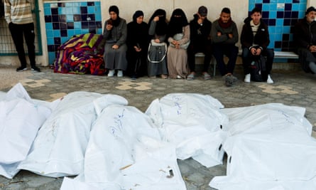 Palestinians mourn loved ones killed in Israeli strikes in Khan Younis.