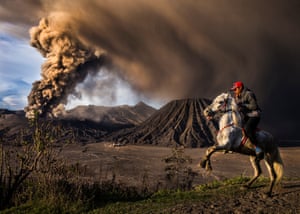 The Mount Bromo volcano erupts in Indonesia.