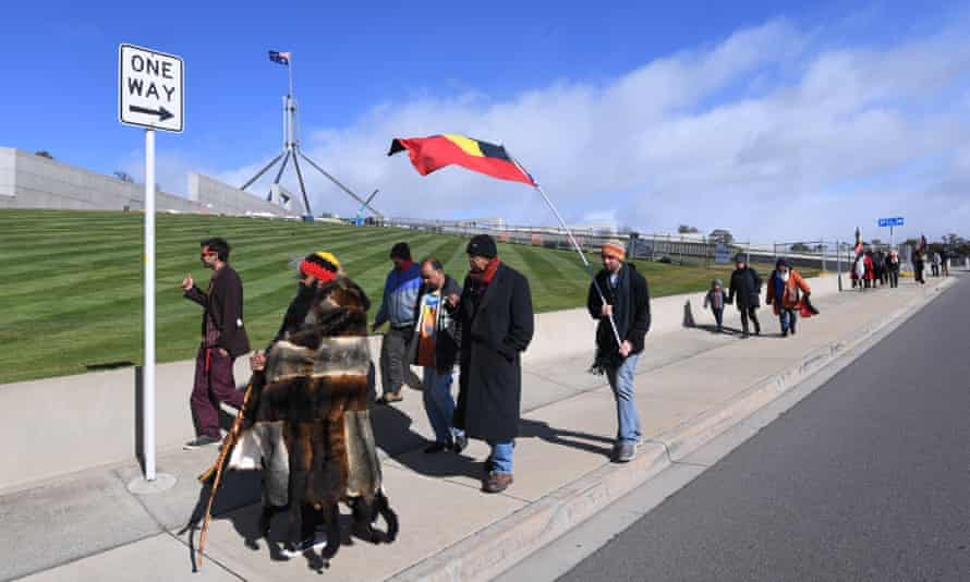 Clinton Pryor (second from left) walks around Parliament House prior to meeting with the prime minister.
