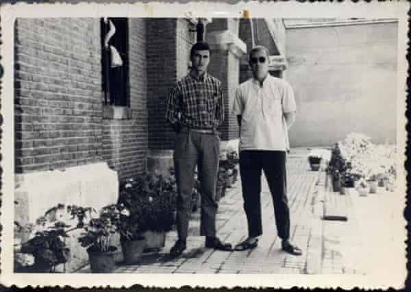 Stuart Christie and British prisoner Jimmy Wagner standing, looking relaxed, next to potted plants and a brick wall at Madrid’s Carabanchel prison in 1967