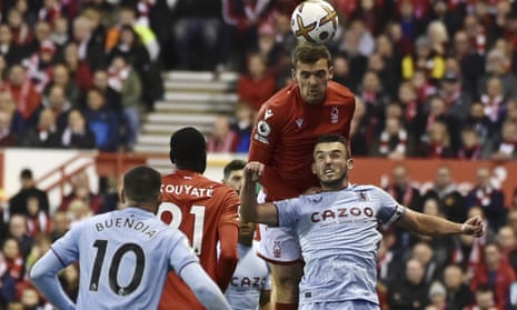 Nottingham Forest's Harry Toffolo beats Aston Villa's John McGinn in the air.