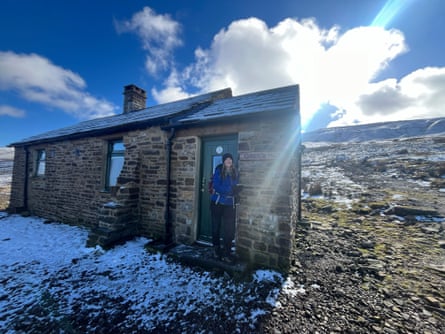 Phoebe Smith at Greg’s Hut, a former miners’ hut now looked after by the Mountain Bothies Association
