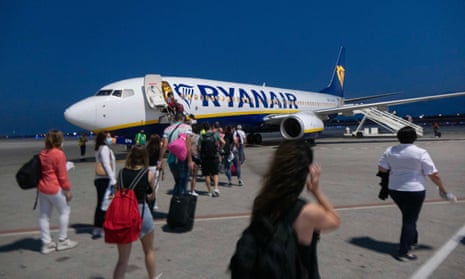 Passengers board a Ryanair plane in Greece last month