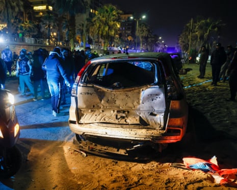 A car targeted in an Israeli drone strike in Ramlet al-Baida, Beirut, on Thursday