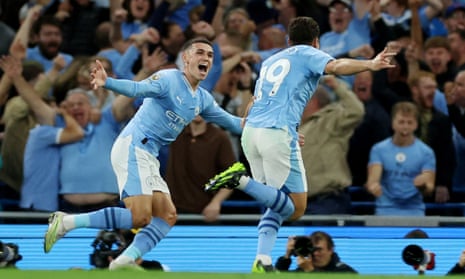 Manchester City’s Julian Alvarez celebrates scoring their first goal with Phil Foden.