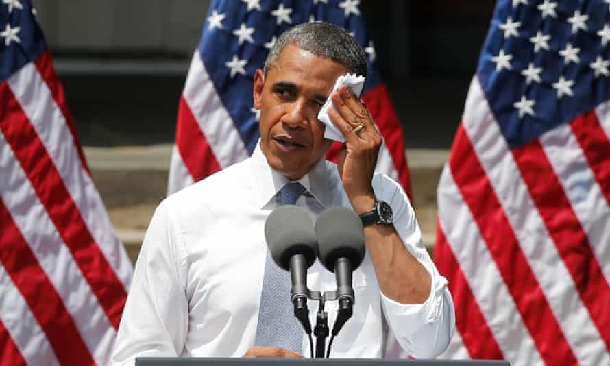 President Barack Obama wipes perspiration from his face as he speaks about climate change at Georgetown University in Washington in 2013. Despite signing up to the Paris climate accord he failed to pass major climate crisis legislation.