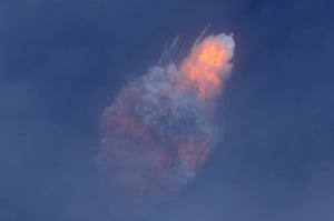 A SpaceX Falcon 9 rocket engine self-destructs after jettisoning the Crew Dragon astronaut capsule during an in-flight abort test.