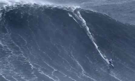 Maya Gabeira surfing a huge wave in Nazaré, Portugal