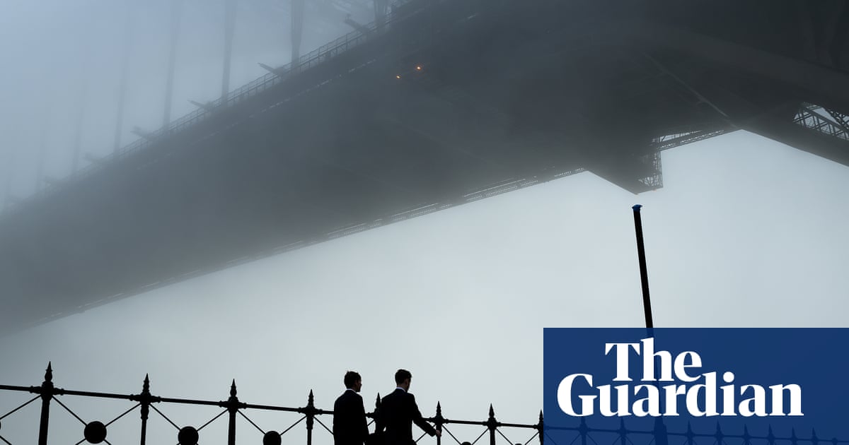 Blanket of fog rolls across Sydney harbour, causing travel chaos – video