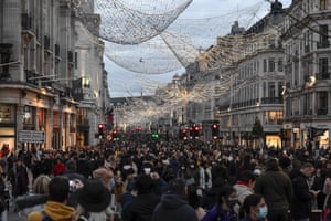 Coronavirus live news: UK records 21,502 new cases and 519 deaths; Peru suspends trials of China vaccine | World news 2 Crowds of shoppers walk under the Christmas lights in Regent Street, in London, Saturday, 12 December, 2020. The British health secretary Matt Hancock says infections are starting to rise in some areas after falling during a four-week national lockdown in England that ended on 2 December.