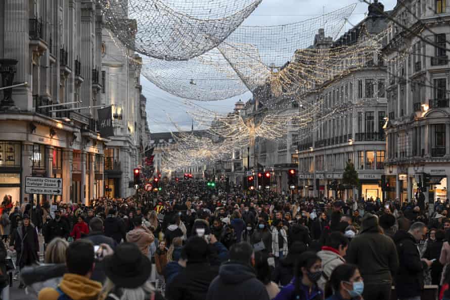 Crowds of shoppers walk under the Christmas lights in Regent Street, in London, Saturday, 12 December, 2020. The British health secretary Matt Hancock says infections are starting to rise in some areas after falling during a four-week national lockdown in England that ended on 2 December.