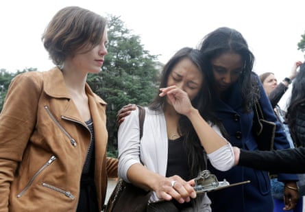 University of California graduate student Kathleen Gutierrez, center, is comforted by graduate student Erin Bennett, left, and Tyann Sorrell before all spoke at a news conference about sexual harassment claims.
