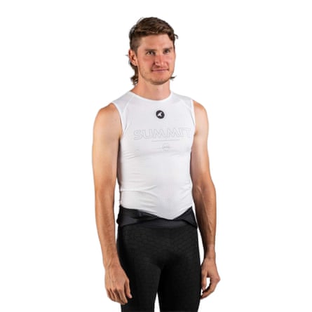 A person wears a white Pactimo summit sleeveless te-shirt.