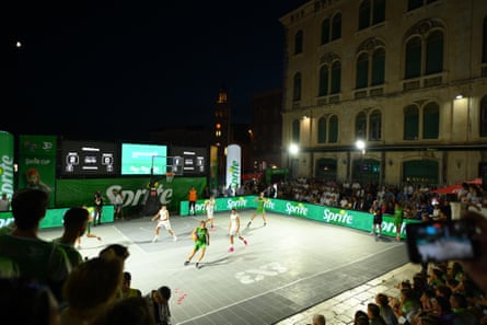 Young players compete in the 3x3 basketball tournament.