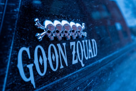 5 skulls and crossbones pictured on a car above the words Goon Zquad.