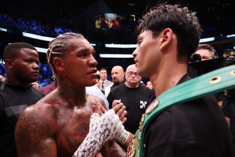 Conor Benn and Ryan Garcia embrace after Garcia's TKO victory in their WBC welterweight title fight.