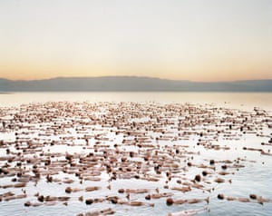 A thousand models stripped naked for artist Spencer Tunick to create the latest in his series of mass nudes, this time in Israel. The artwork was made to raise awareness of receding water levels in the Dead Sea.