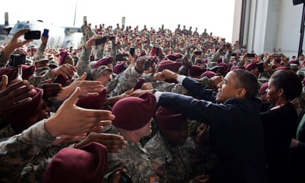 Barack and Michelle Obama are greeted by troops at Fort Bragg, North Carolina, in December 2011.