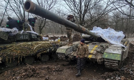 Ukrainian servicemen stand by their tanks near the frontline town of Bakhmu.