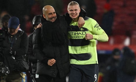 Manchester City's manager Pep Guardiola (left) celebrates with his match-winning goalscorer Erling Haaland after the English Premier League football match between Crystal Palace and Manchester City.