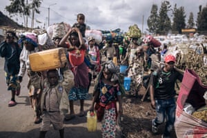 War-displaced people flee towards the city of Goma