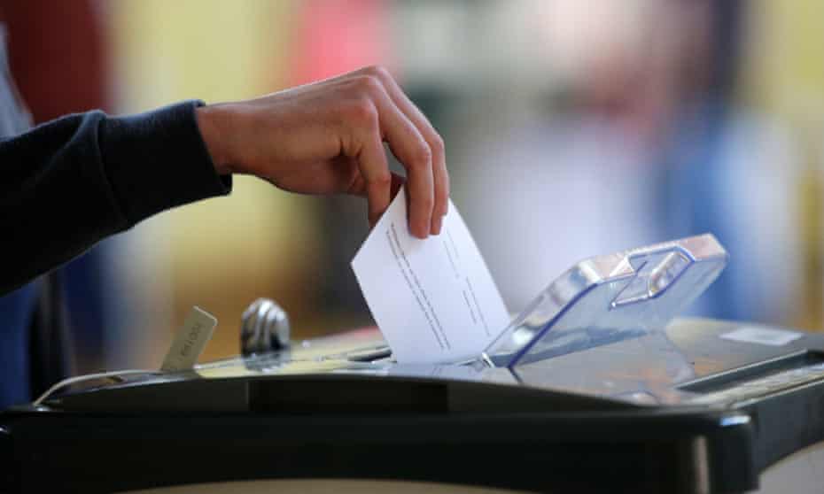 A voter casts their ballot in a referendum in Dublin, Ireland.