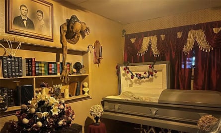 room with books and open coffin