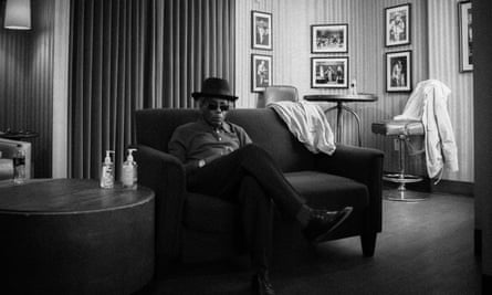 Black and white picture of Peter One sitting on a sofa