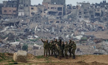 Female Israeli soldiers pose for a photograph on the Gaza Strip border