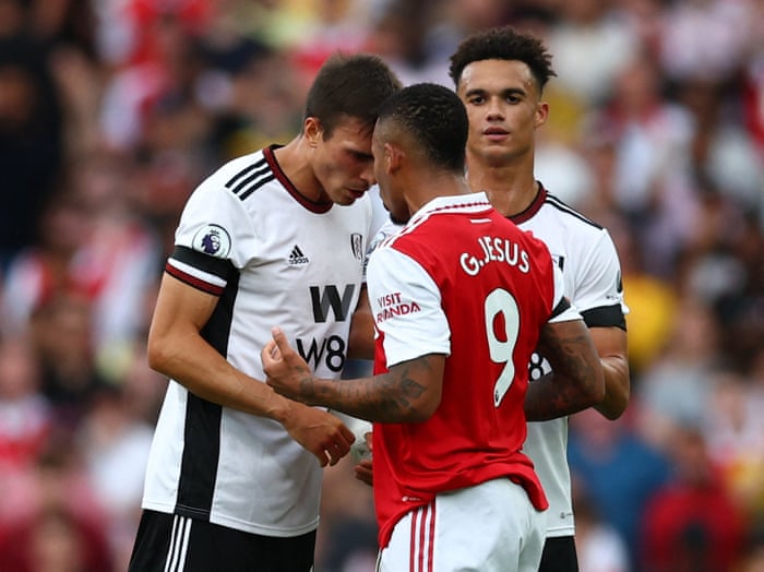 Arsenal's Gabriel Jesus clashes with Fulham's Joao Palhinha as Antonee Robinson intervenes.