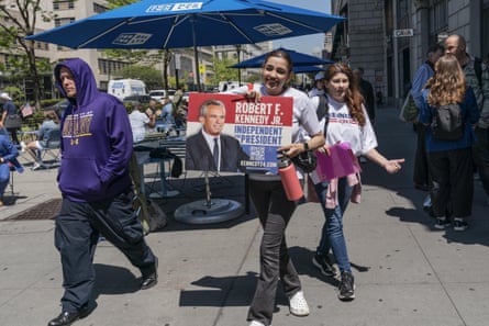 people hold a sign that reads “Robert F Kennedy Jr independent for president”