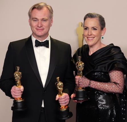 Power couple … Nolan and his producer and wife Emma Thomas pose with their Oscars.