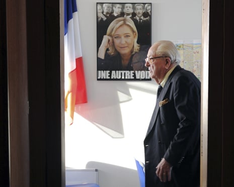Front National honorary president Jean-Marie Le Pen, who died in January 2025, is pictured next to a campaign poster of his daughter, the president of the party Marine Le Pen.