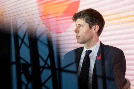 a man in a suit looking left