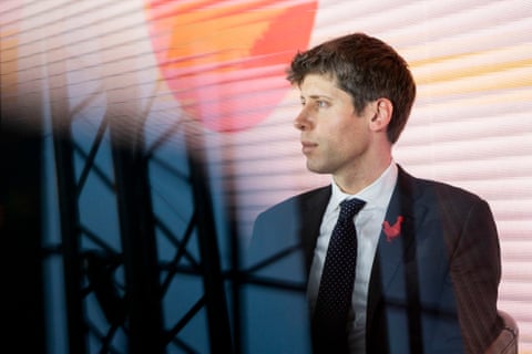 a man in a suit looking left