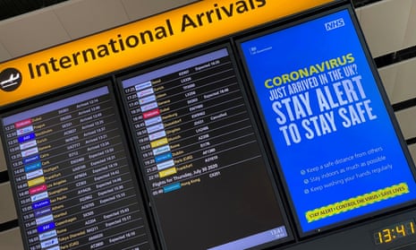 A public health campaign message is displayed on an arrivals information board at Heathrow airport.