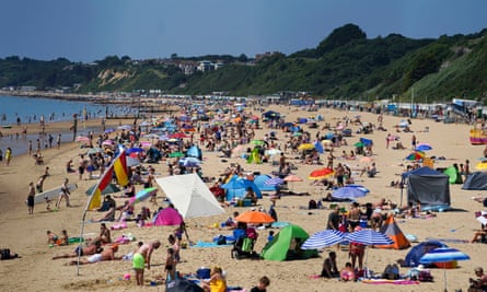 People on Bournemouth beach in Dorset. The season we used to anticipate as the lightest and brightest time of the year now comes with health warnings.
