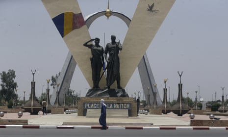 A man walks past "Place de Le Nation" (Monument of independence) park in N'Djamena, Chad