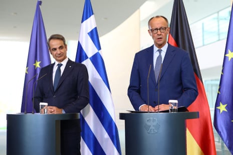 German Chancellor Friedrich Merz and Greek prime minister Kyriakos Mitsotakis attend a joint press conference in Berlin, Germany.
