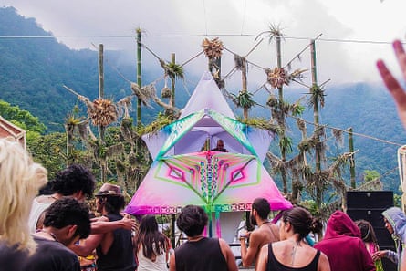 A DJ plays to a small crowd of partygoers at Cosmic Convergence, Lago Atitlan, Guatemala.