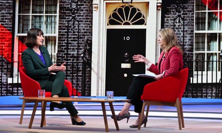 Rachel Reeves and Laura Kuenssberg sat facing each other in front of a backdrop of downing street
