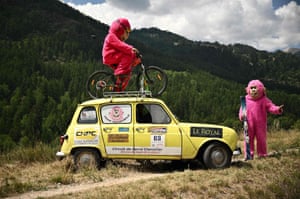 Spectators in costume line the race route during the 12th stage between Briançon and L’Alpe-d’Huez in the French Alp