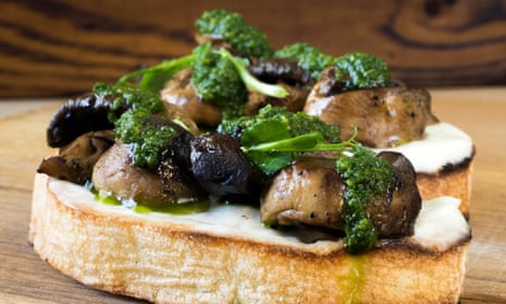Bruschetta topped with baked mushrooms, cream cheese and spinach sauce.