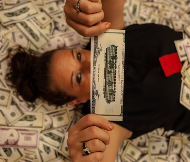 Jessica King, one of the student strikers, holds fake money that asks: how far to free?