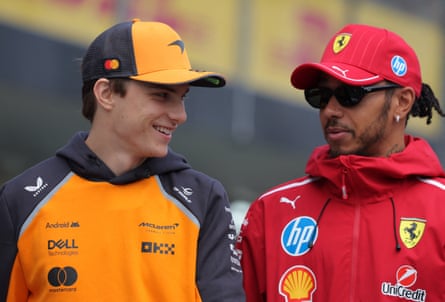 McLaren’s Oscar Piastri (left) chats with Ferrari driver Lewis Hamilton.