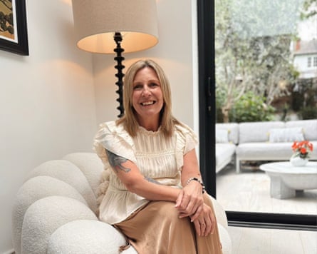 Amanda Stanhope sitting on a sofa smiling for photo