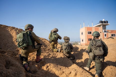 This photo released by the Israel Defense Forces on 10 December shows Israeli troops conducting military operations at an undisclosed location inside the Gaza Strip.